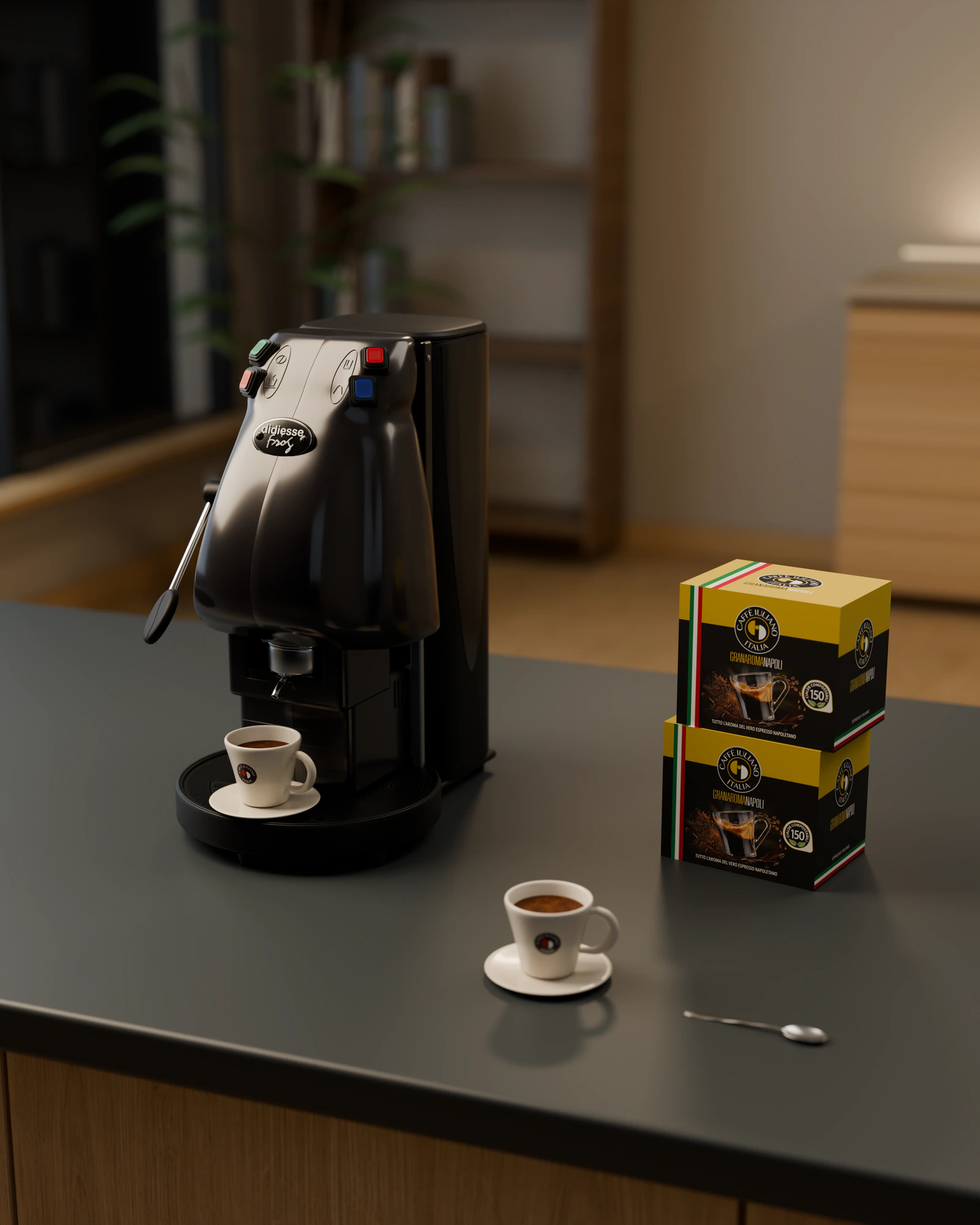 Aparati Frog i zi mbi një banak të errët zyre, me dy kuti Gran Aroma Napoli dhe një filxhan espresso
